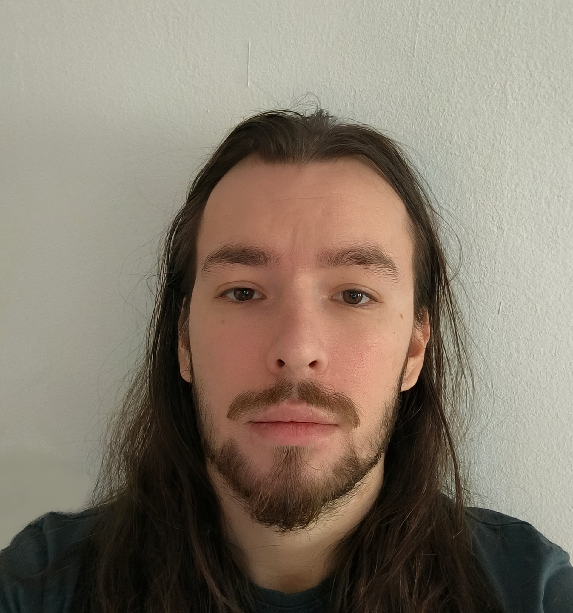 Professional headshot of Kósa Mátyás, a software engineer